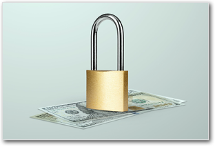 A lock on top of dollar bills